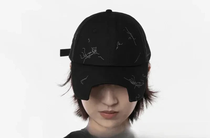 Model wearing the cap pulled down over the eyes, white studio background