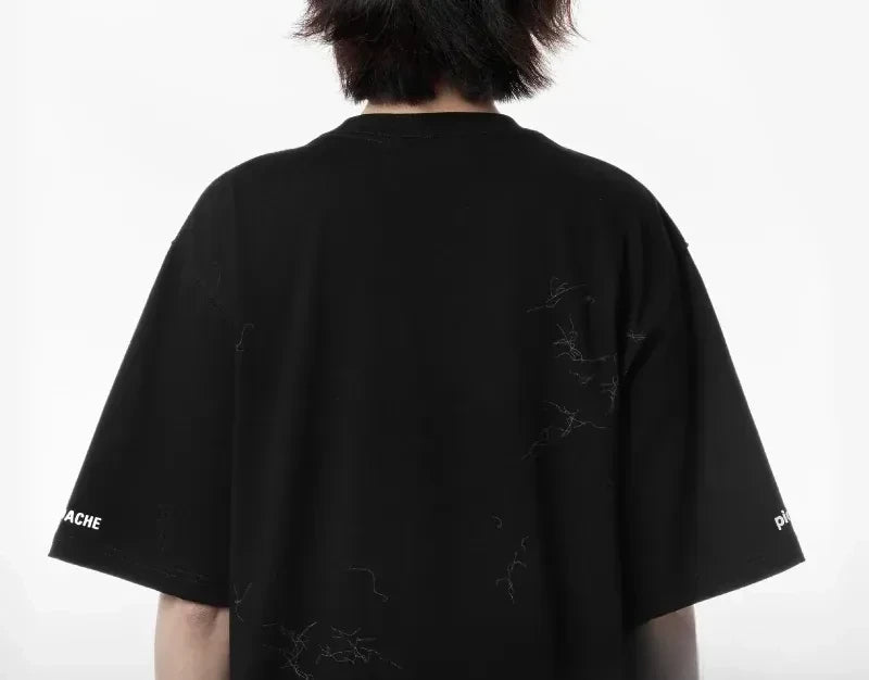 Model seen from behind in the tee, the cat-hair print running across the shoulders