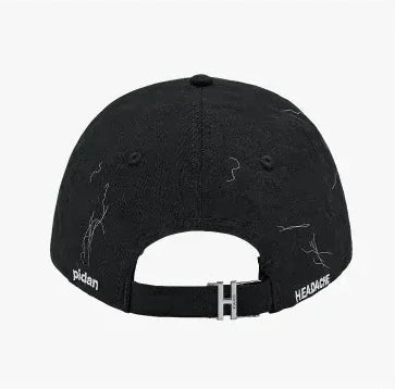 Back of the same cap, showing the adjuster strap